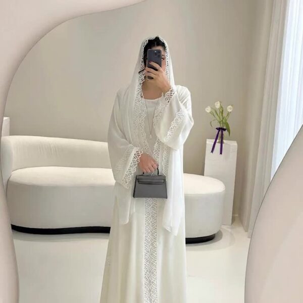Exquisite Desert Bloom Lace Kaftan Set from Newness, perfect for Ramadan and special occasions. Features delicate lace detailing and a flowing silhouette.