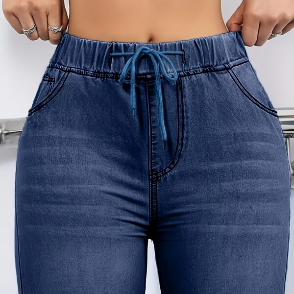 Flatlay of Newness Effortless Chic Elastic Waist Jeans, showcasing the comfortable elastic waistband and flattering fit.