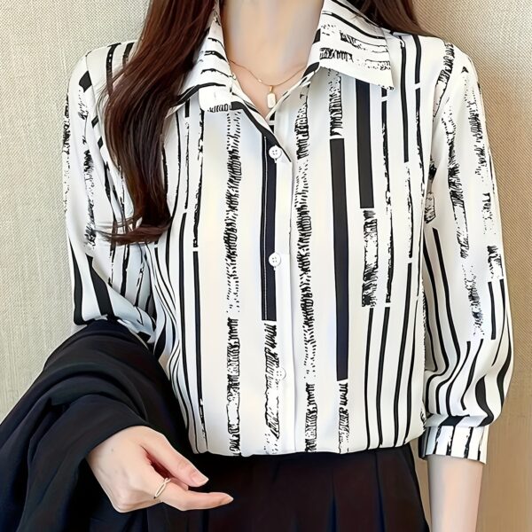 Newness Effortless Chic Striped Polo Shirt in spring or fall. Model wearing a navy and white striped polo shirt.