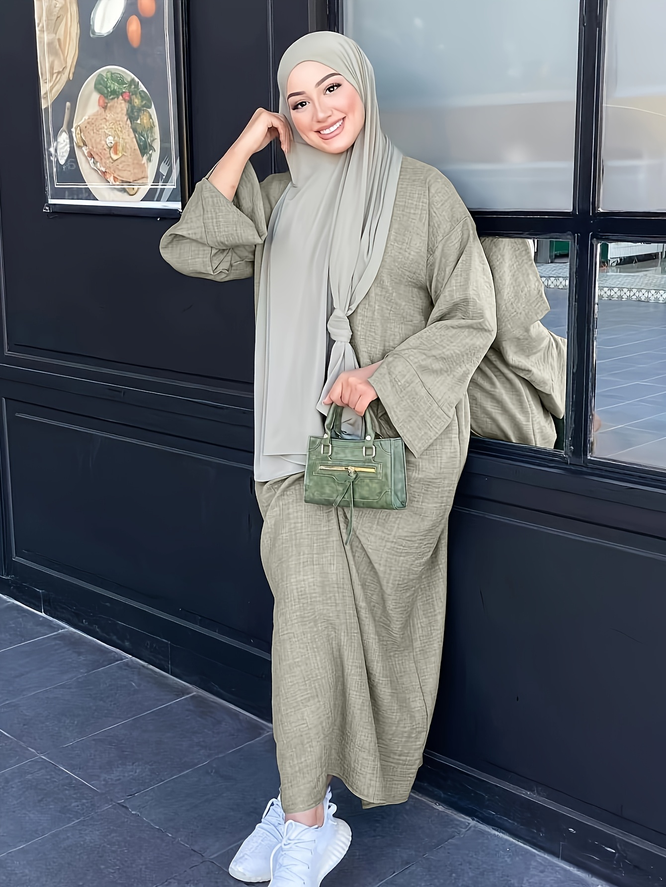 Effortlessly chic Dubai Abaya Robe from Newness, perfect for any occasion. A flowing, elegant robe in a luxurious fabric.