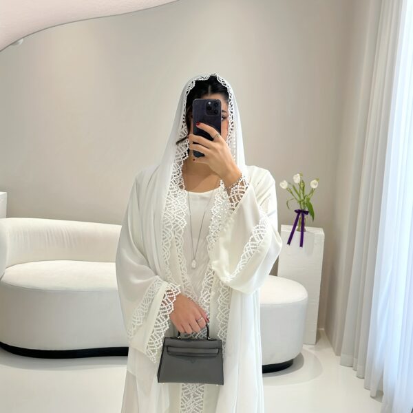 Exquisite Desert Bloom Lace Kaftan Set from Newness, perfect for Ramadan and special occasions. Features delicate lace detailing and a flowing silhouette.