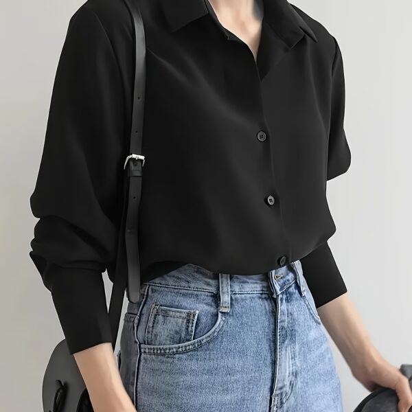The Effortless Black Shirt from Newness: A versatile, chic black shirt perfect for any occasion.