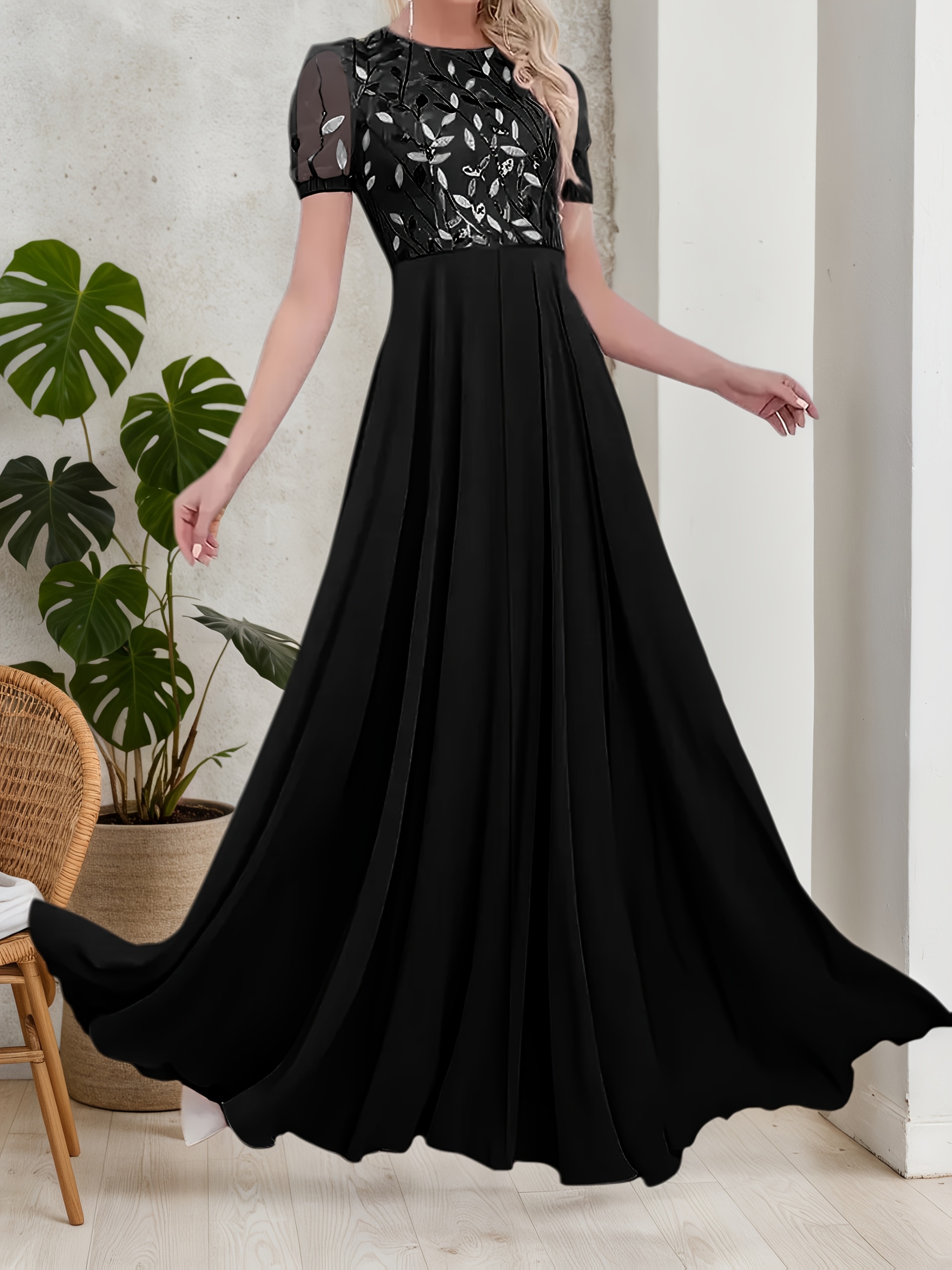 Model wearing a stunning Midnight Bloom sequin maxi dress, perfect for parties and special events. The dress features dazzling sequins and a flowing maxi silhouette.