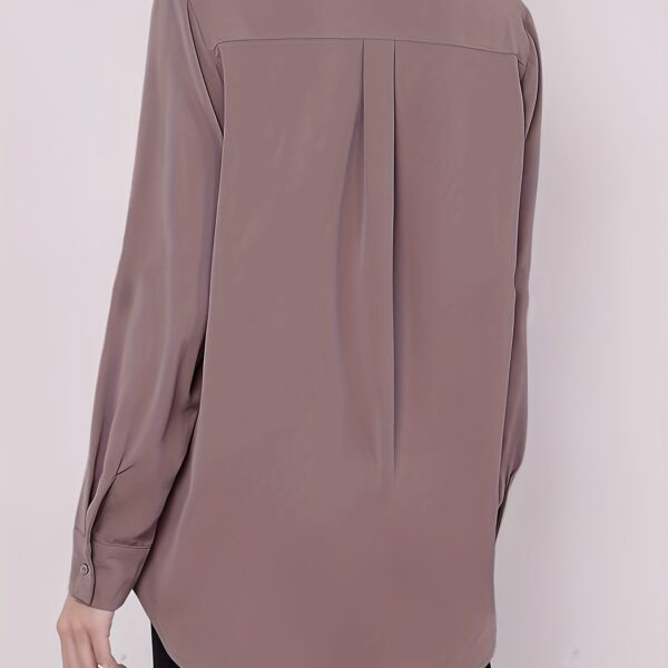 Newness' Executive Black Blouse: An elegant, versatile black blouse perfect for any occasion. Close-up showcasing the fabric's texture and drape.