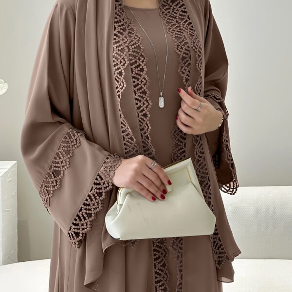 Exquisite Desert Bloom Lace Kaftan Set from Newness, perfect for Ramadan and special occasions. Features delicate lace detailing and a flowing silhouette.