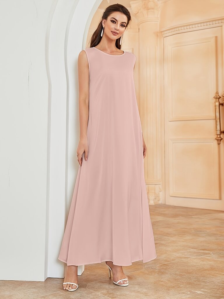 Model wearing the Serene Sunset Abaya Dress a flowing maxi dress in sunset hues showcasing its elegant and modest design
