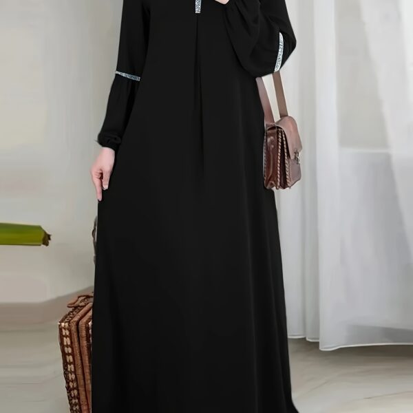 Exquisite Dubai Nights Sequined Abaya Dress from Newness, shimmering with elegance. Modern and stylish abaya design.