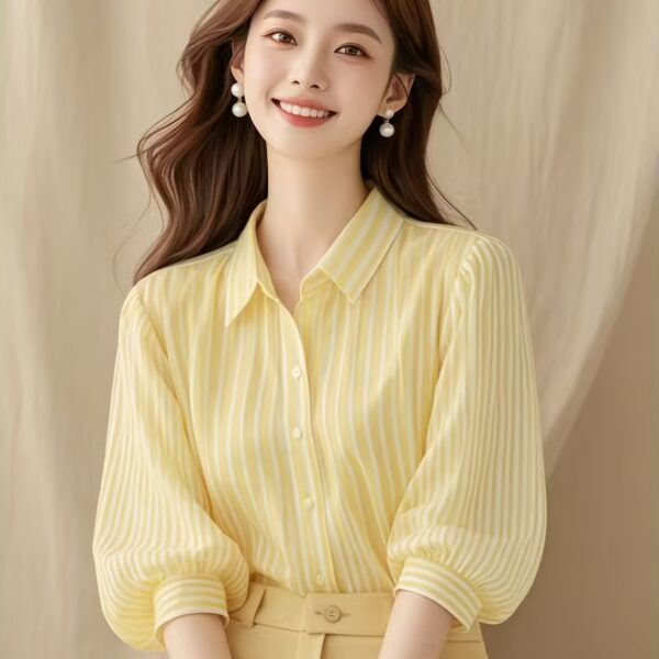 Newness French Riviera Striped Blouse: A stylish, striped women's blouse perfect for summer. Model showcasing the flattering fit and chic design.