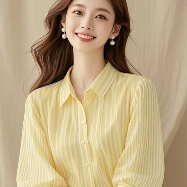 Newness French Riviera Striped Blouse: A stylish, striped women's blouse perfect for summer. Model showcasing the flattering fit and chic design.