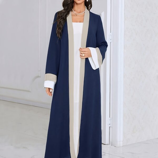 Model wearing the Casablanca Color-Block Abaya Dress, a stylish and modern abaya with colorblocked panels. The dress features a relaxed fit and elegant silhouette.