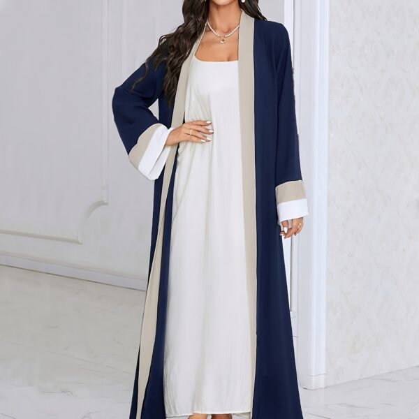 Model wearing the Casablanca Color-Block Abaya Dress, a stylish and modern abaya with colorblocked panels. The dress features a relaxed fit and elegant silhouette.