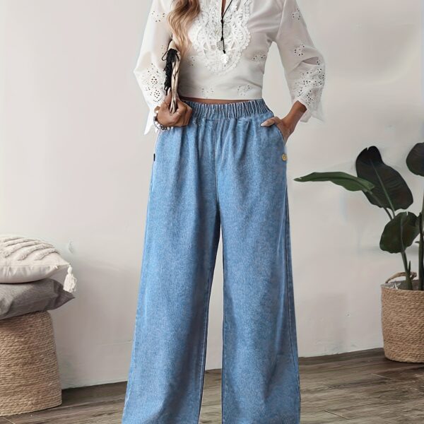 Flattering straight leg jeans in a versatile wash, showcasing a chic and effortless style. Model wearing Newness Effortless Chic Straight Leg Jeans.