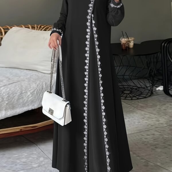 Model wearing the Newness Serene Crochet Maxi Dress, a stunning floor-length crochet dress perfect for any occasion. The dress drapes beautifully, showcasing its intricate crochet detailing.