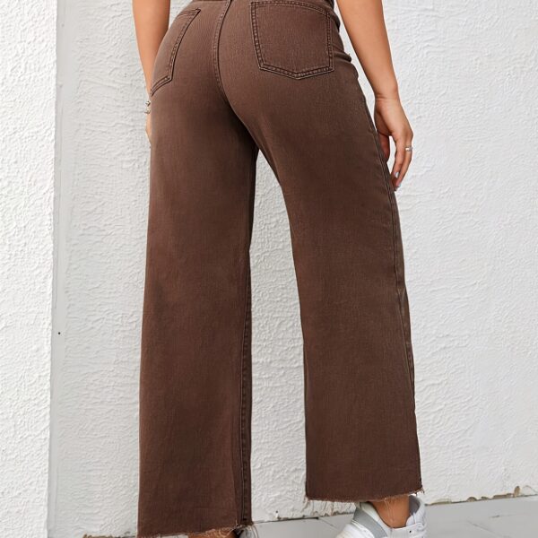 Newness Effortless Chic Wide Leg Jeans: Flattering wide-leg jeans in a versatile wash, perfect for any occasion. Model showcases effortless style.