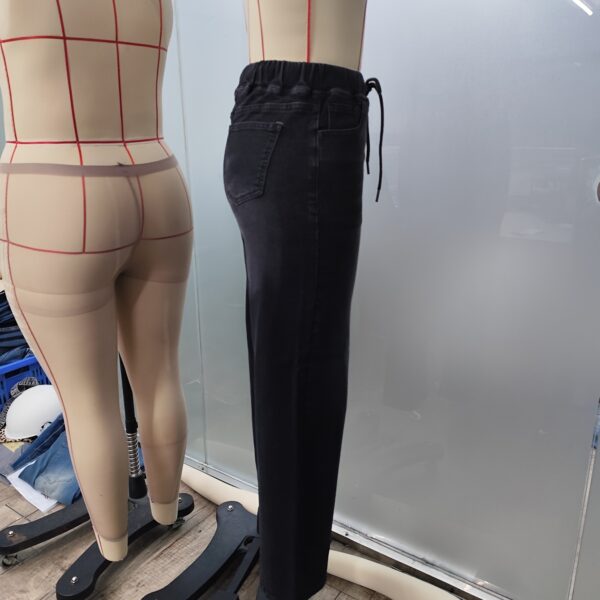 Effortless Chic Stretch Denim Jeans by Newness. A model wears the comfortable, stylish, and versatile jeans.