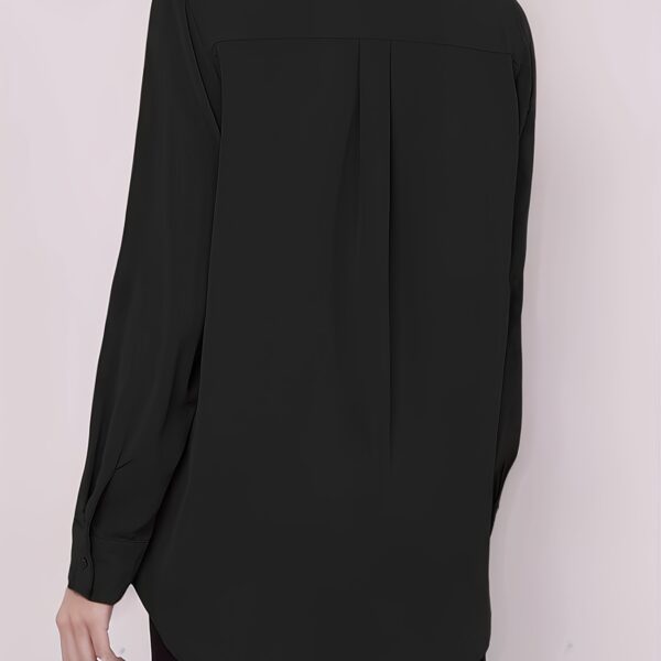 Newness' Executive Black Blouse: An elegant, versatile black blouse perfect for any occasion. Close-up showcasing the fabric's texture and drape.