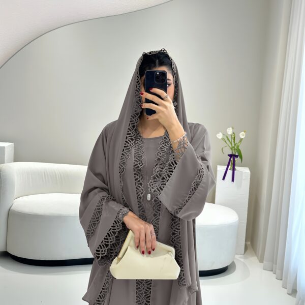 Exquisite Desert Bloom Lace Kaftan Set from Newness, perfect for Ramadan and special occasions. Features delicate lace detailing and a flowing silhouette.