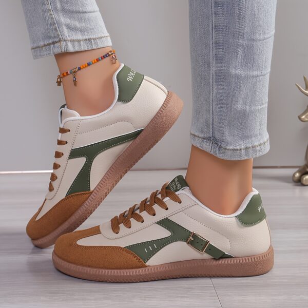 Newness Effortless Chic Beige Sneakers: A pair of stylish beige sneakers, perfect for elevating any outfit. Close-up showcasing the shoe's texture and design details.