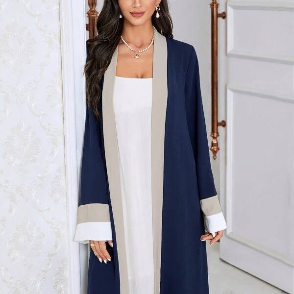 Model wearing the Casablanca Color-Block Abaya Dress, a stylish and modern abaya with colorblocked panels. The dress features a relaxed fit and elegant silhouette.