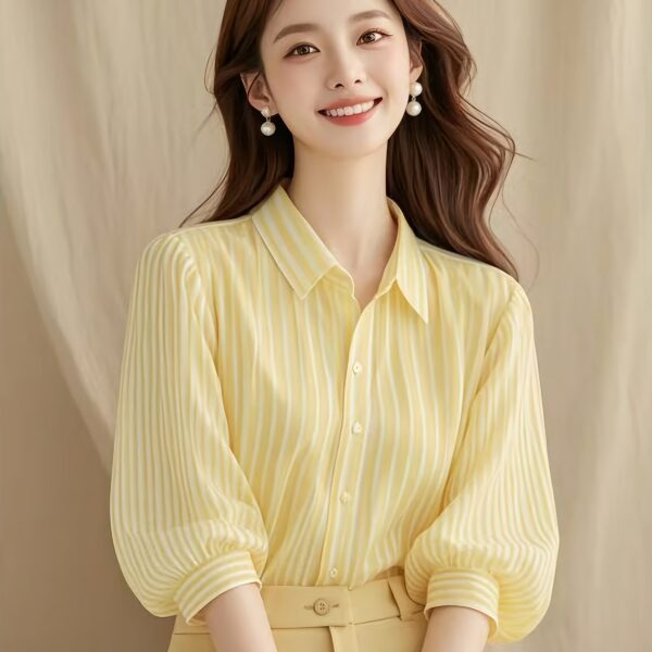 Newness French Riviera Striped Blouse: A stylish, striped women's blouse perfect for summer. Model showcasing the flattering fit and chic design.