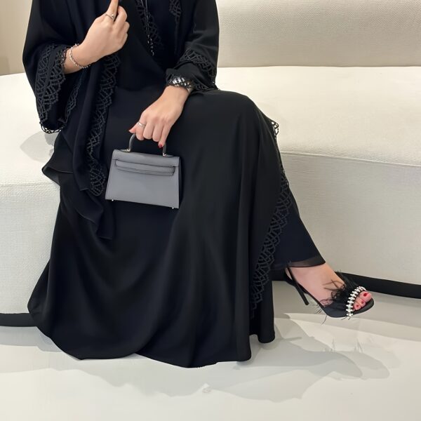 Exquisite Desert Bloom Lace Kaftan Set from Newness, perfect for Ramadan and special occasions. Features delicate lace detailing and a flowing silhouette.