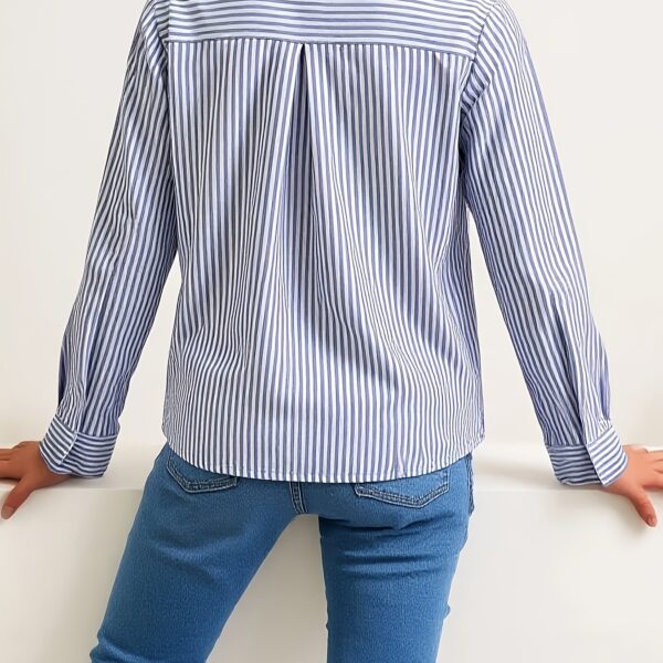 Effortless Elegance Striped Shirt from Newness. A stylish and versatile striped shirt perfect for any occasion.