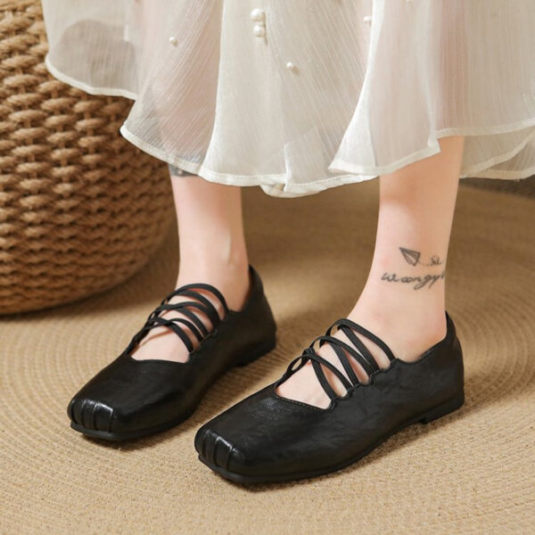 Newness Chloé Lace-Up Mary Jane Flats in classic black, featuring delicate lace-up detailing and a comfortable low heel. Perfect for adding a touch of elegance to any outfit.