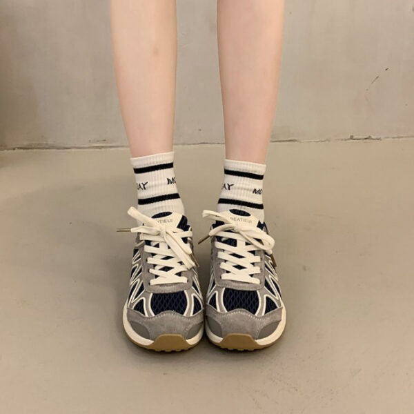 Newness Elevated Style Platform Sneakers in white, showcasing their chic design, comfortable platform sole, and stylish silhouette. Model is walking, highlighting ease of movement.