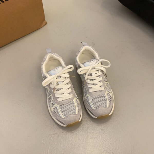 Newness Elevated Style Platform Sneakers in white, showcasing their chic design, comfortable platform sole, and stylish silhouette. Model is walking, highlighting ease of movement.