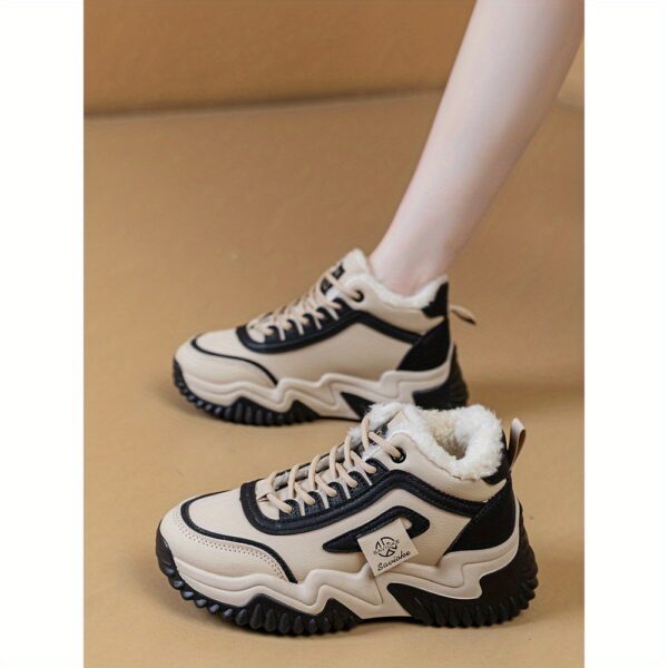 Newness CityStride Low-Top Sneakers: Elevate your style with these versatile sneakers, perfect for any occasion. Image shows the shoes from a side angle showcasing their sleek design and comfortable fit.