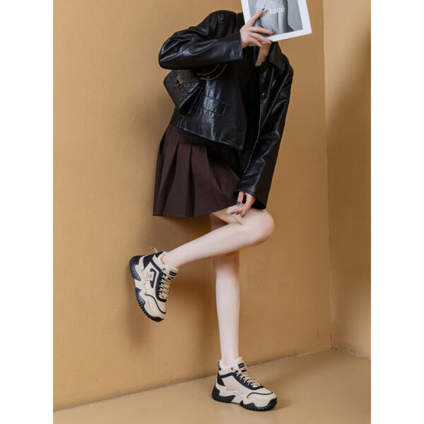 Newness CityStride Low-Top Sneakers: Elevate your style with these versatile sneakers, perfect for any occasion. Image shows the shoes from a side angle showcasing their sleek design and comfortable fit.