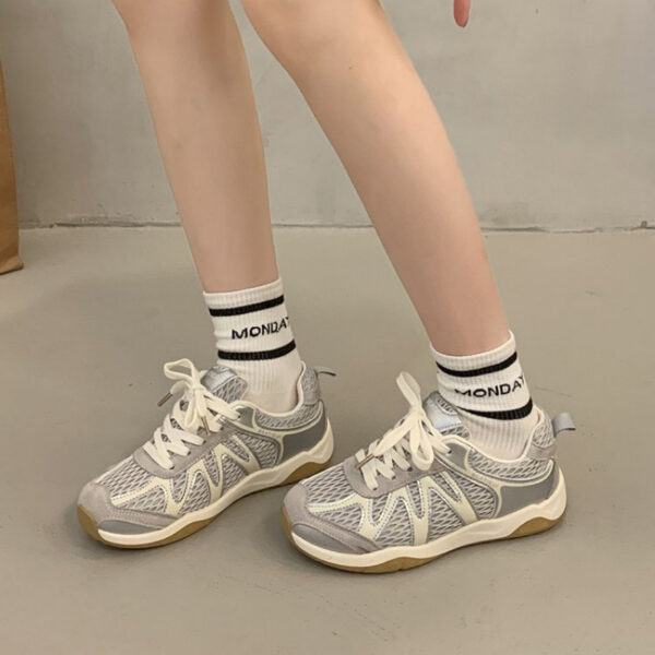 Newness Elevated Style Platform Sneakers in white, showcasing their chic design, comfortable platform sole, and stylish silhouette. Model is walking, highlighting ease of movement.