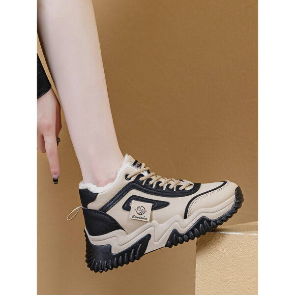 Newness CityStride Low-Top Sneakers: Elevate your style with these versatile sneakers, perfect for any occasion. Image shows the shoes from a side angle showcasing their sleek design and comfortable fit.