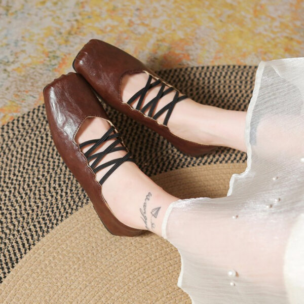 Newness Chloé Lace-Up Mary Jane Flats in classic black, featuring delicate lace-up detailing and a comfortable low heel. Perfect for adding a touch of elegance to any outfit.