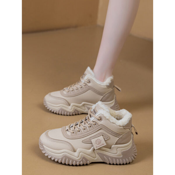 Newness CityStride Low-Top Sneakers: Elevate your style with these versatile sneakers, perfect for any occasion. Image shows the shoes from a side angle showcasing their sleek design and comfortable fit.
