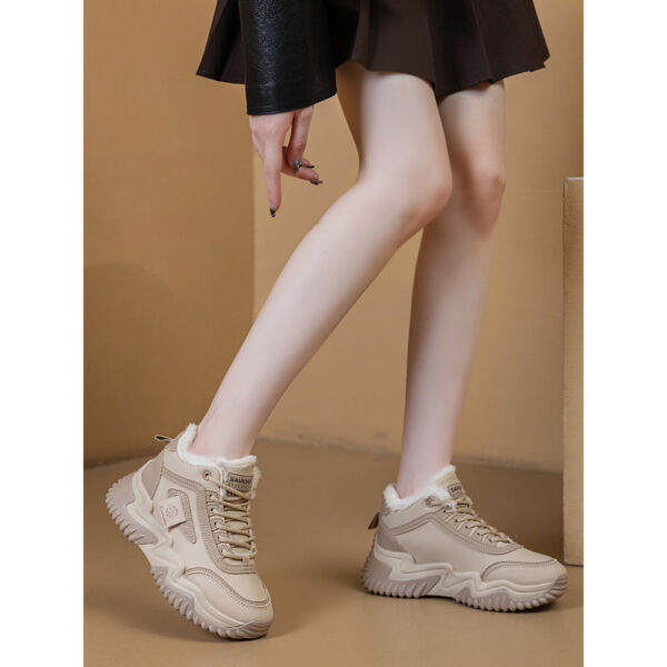 Newness CityStride Low-Top Sneakers: Elevate your style with these versatile sneakers, perfect for any occasion. Image shows the shoes from a side angle showcasing their sleek design and comfortable fit.