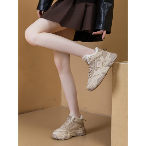 Newness CityStride Low-Top Sneakers: Elevate your style with these versatile sneakers, perfect for any occasion. Image shows the shoes from a side angle showcasing their sleek design and comfortable fit.