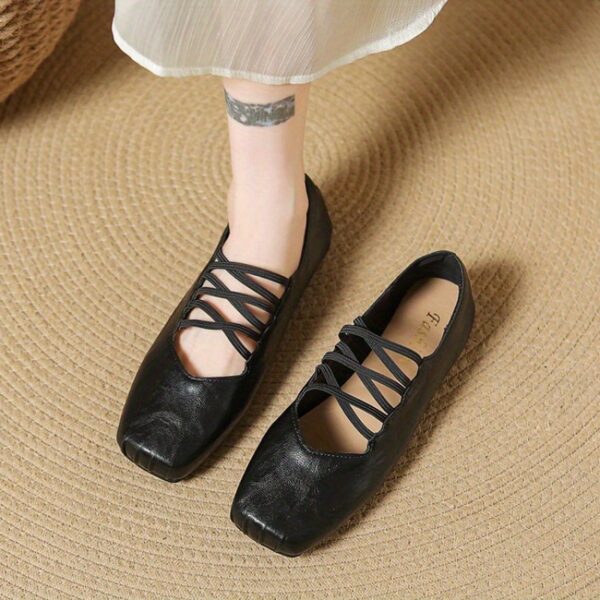 Newness Chloé Lace-Up Mary Jane Flats in classic black, featuring delicate lace-up detailing and a comfortable low heel. Perfect for adding a touch of elegance to any outfit.