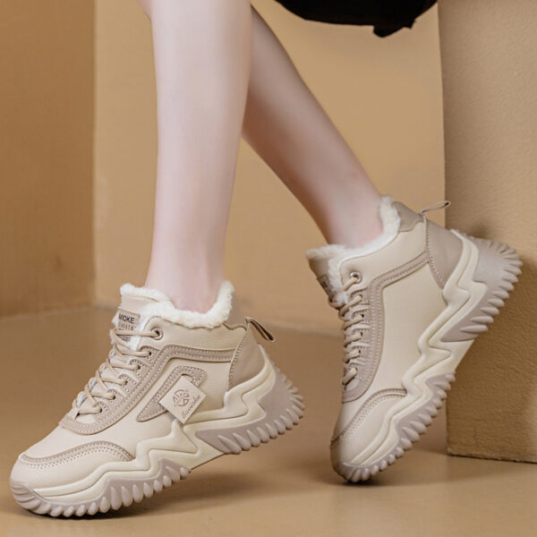 Newness CityStride Low-Top Sneakers: Elevate your style with these versatile sneakers, perfect for any occasion. Image shows the shoes from a side angle showcasing their sleek design and comfortable fit.