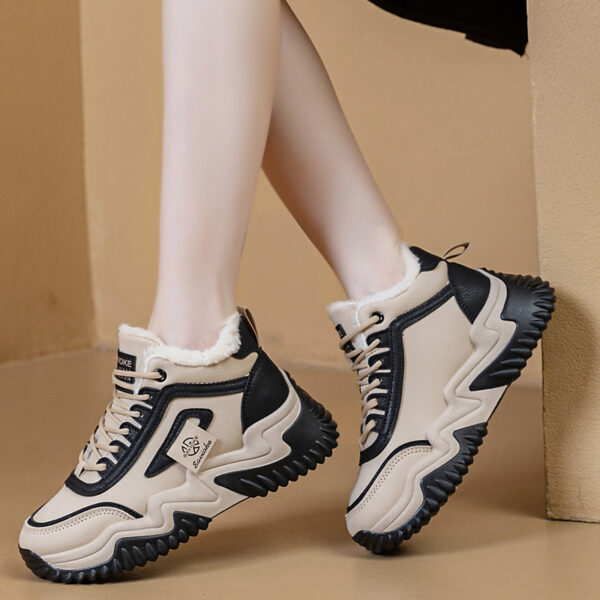 Newness CityStride Low-Top Sneakers: Elevate your style with these versatile sneakers, perfect for any occasion. Image shows the shoes from a side angle showcasing their sleek design and comfortable fit.