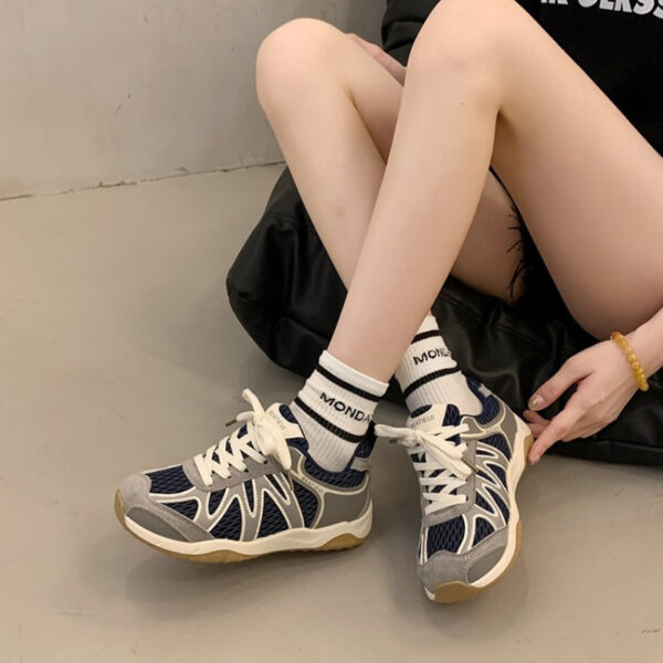Newness Elevated Style Platform Sneakers in white, showcasing their chic design, comfortable platform sole, and stylish silhouette. Model is walking, highlighting ease of movement.