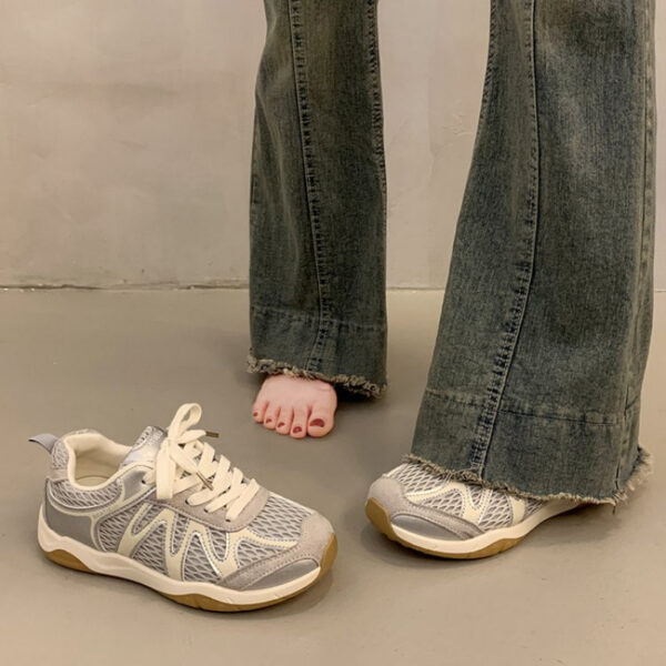Newness Elevated Style Platform Sneakers in white, showcasing their chic design, comfortable platform sole, and stylish silhouette. Model is walking, highlighting ease of movement.