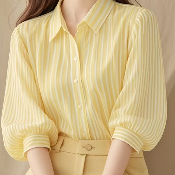 Newness French Riviera Striped Blouse: A stylish, striped women's blouse perfect for summer. Model showcasing the flattering fit and chic design.