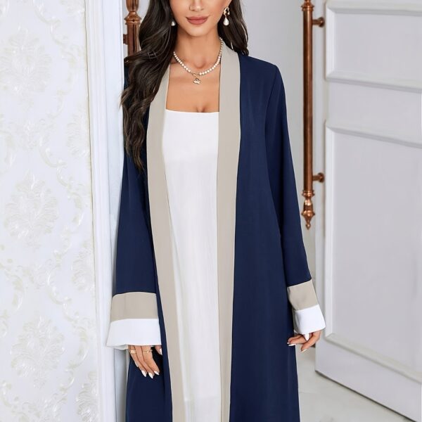 Model wearing the Casablanca Color-Block Abaya Dress, a stylish and modern abaya with colorblocked panels. The dress features a relaxed fit and elegant silhouette.