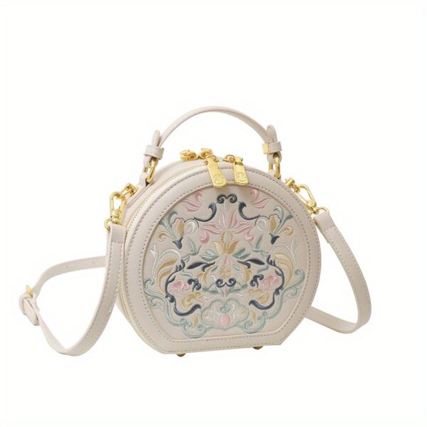 Vienna Embroidered Crossbody Bag in chic faux leather with golden hardware and unique embroidered design.