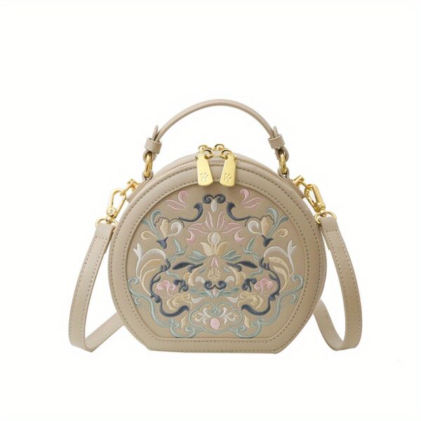 Vienna Embroidered Crossbody Bag in chic faux leather with golden hardware and unique embroidered design.