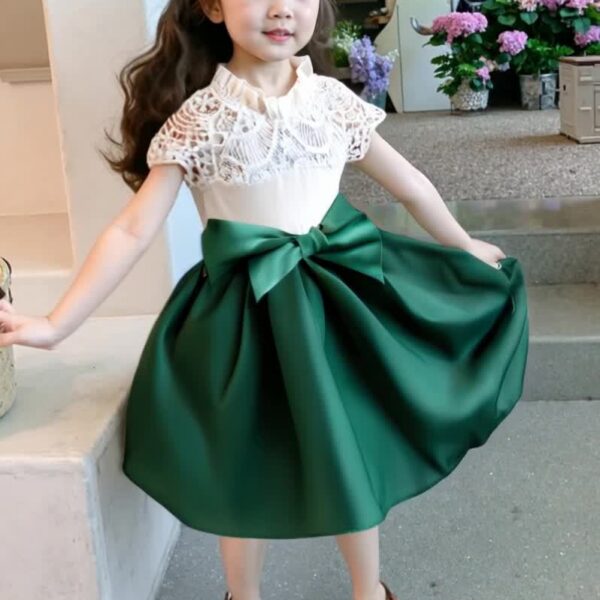Adorable girl wearing a white Summer Bloom Lace Trim Dress, showcasing its delicate lace details and summery style.