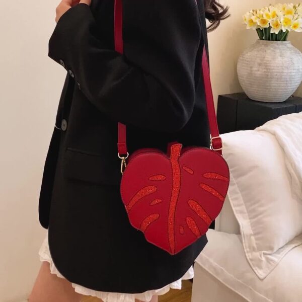 Newness Tropical Escape Leaf Crossbody Bag: A stylish and unique crossbody bag perfect for everyday use or outdoor adventures. Features a leaf-shaped design and adjustable strap.
