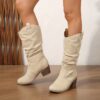 Newness Sunset Rider Ruched Cowboy Boots Brown leather cowboy boots with ruched detailing shown from the side in a lifestyle shot