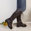 Newness Rebellious Spirit Buckle Knee Boots Elevate your style with these edgy knee high boots featuring a striking buckle detail Perfect for adding a touch of rebellion to any outfit